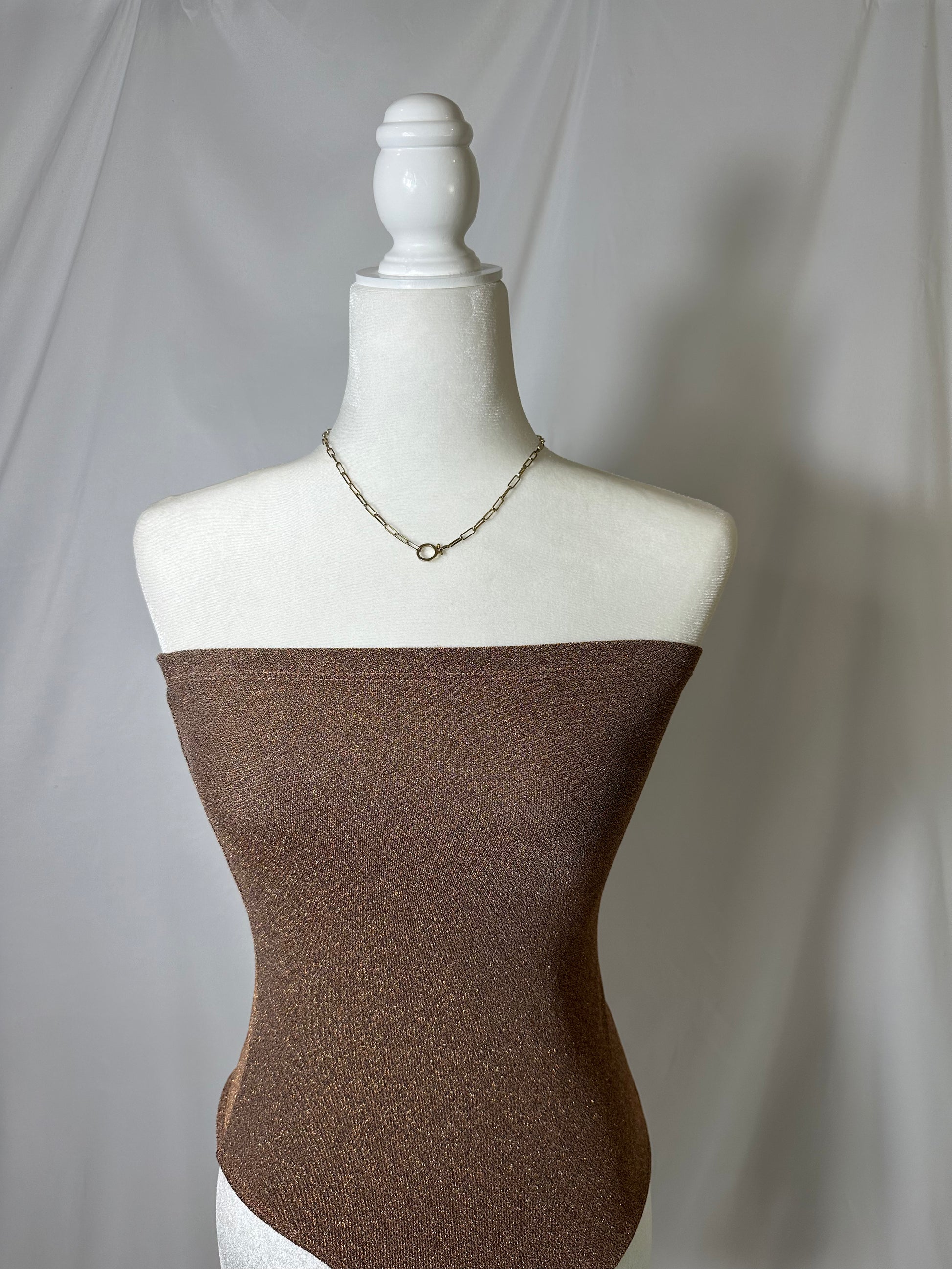 bronze sparkly tube top on mannequin
