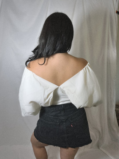 white off the shoulder corset top with off the shoulder balloon sleeves on model 