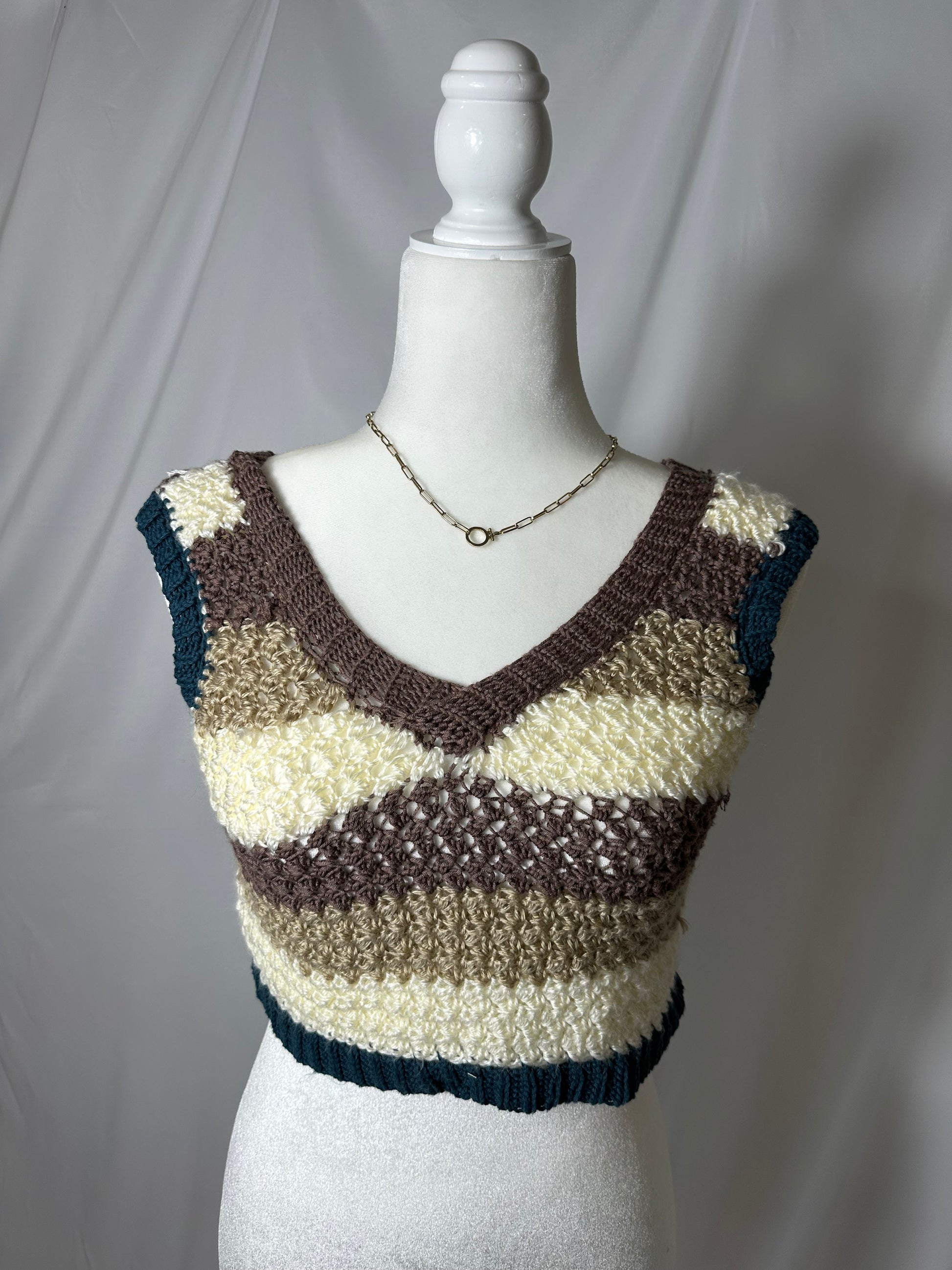 blue brown and cream striped hand knit tank top on mannequin