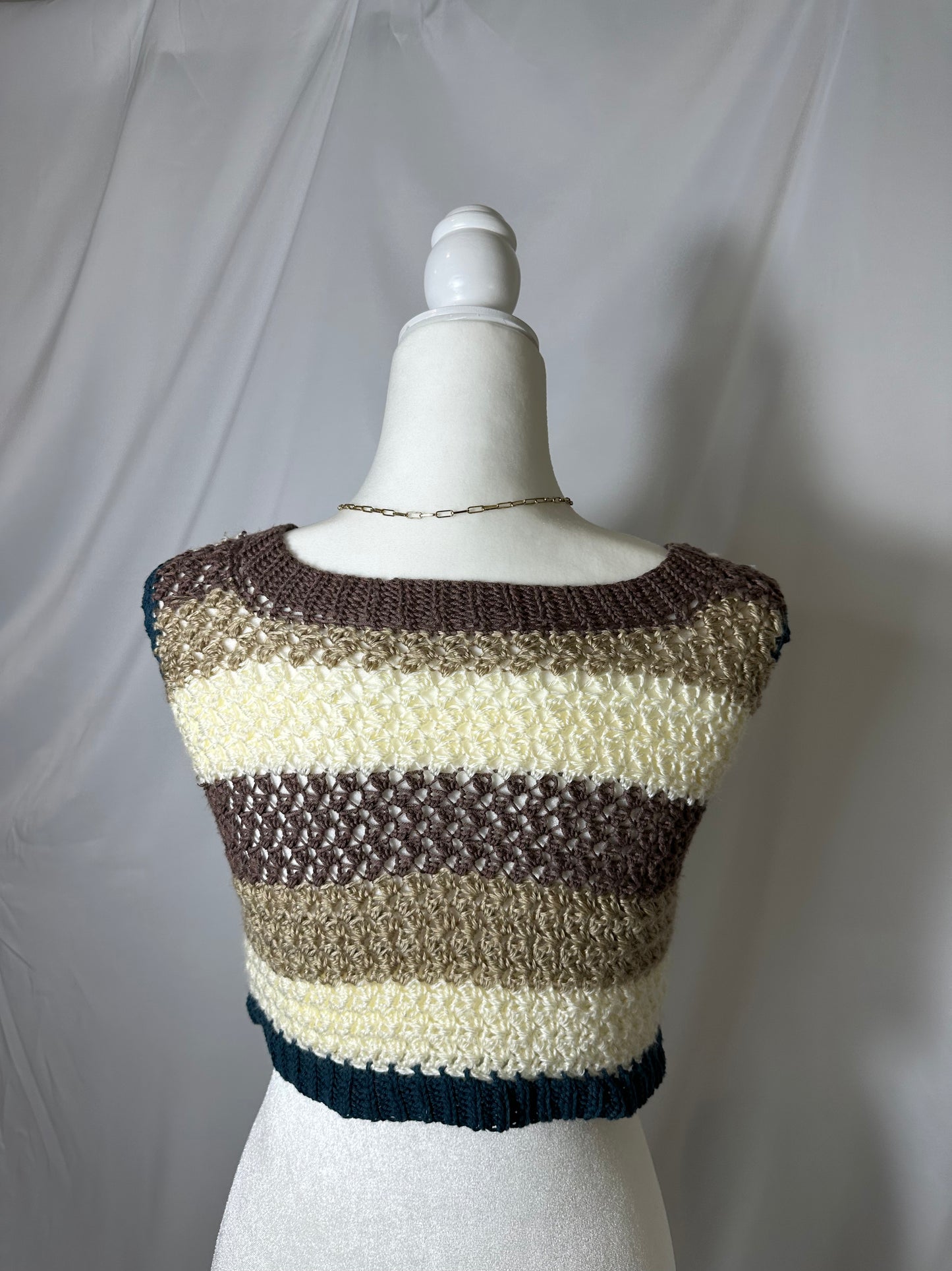 blue brown and cream striped hand knit tank top on mannequin