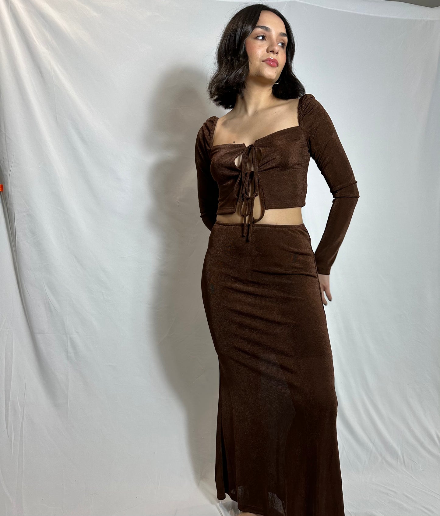 brown two piece set with long sleeve tie front top and midi skirt with slip underneath