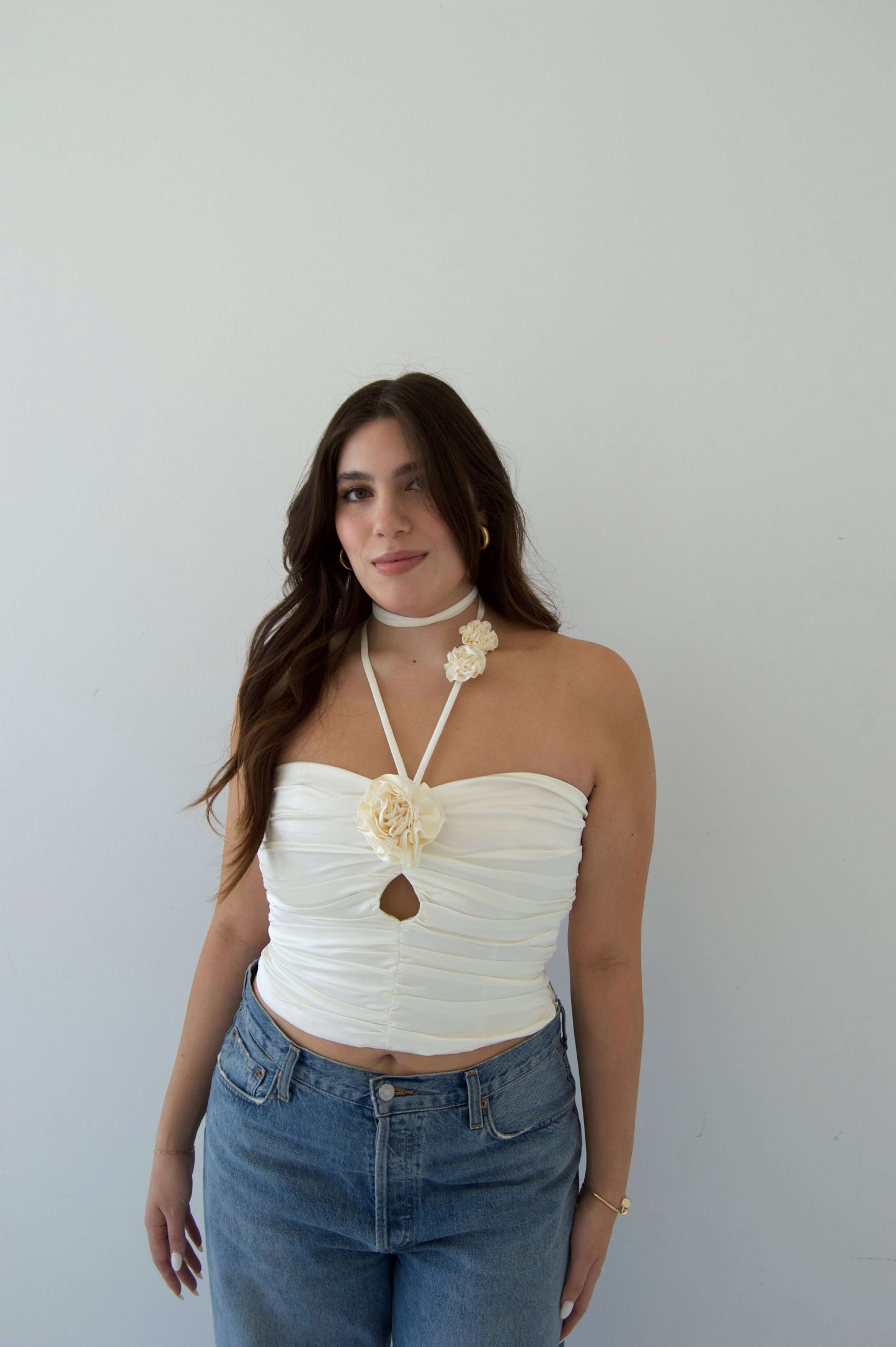 white shiny ruched strapless tube top with halter rosette ties around neck